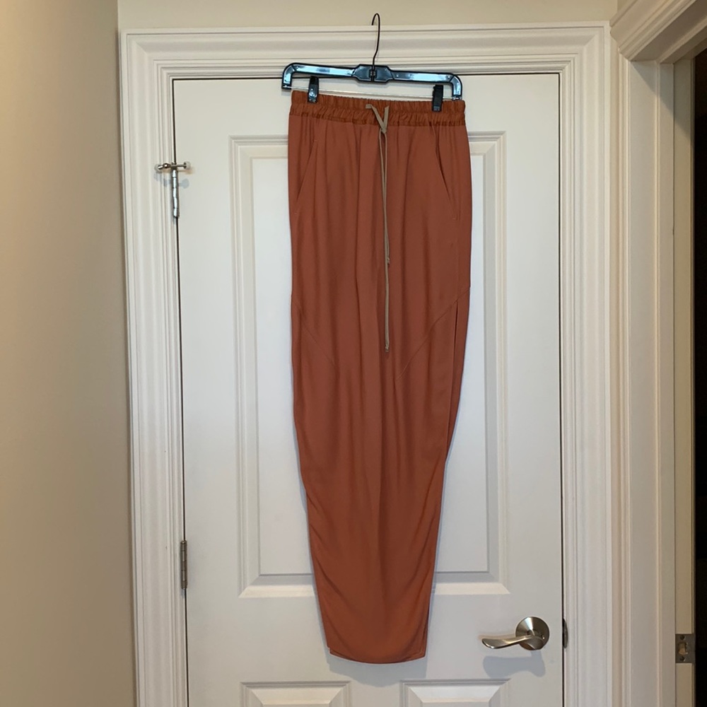 Rick Owens long coral skirt with high slit and elasticized drawstring waistband.